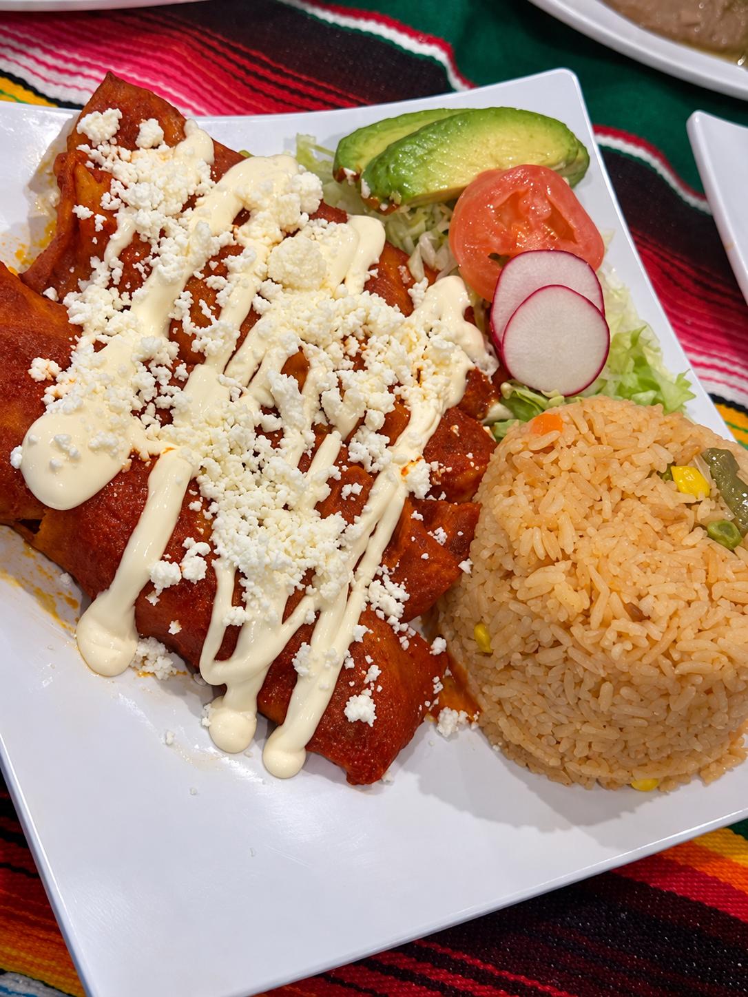 Fresh authentic Mexican gorditas and burritos served on a decorative plate